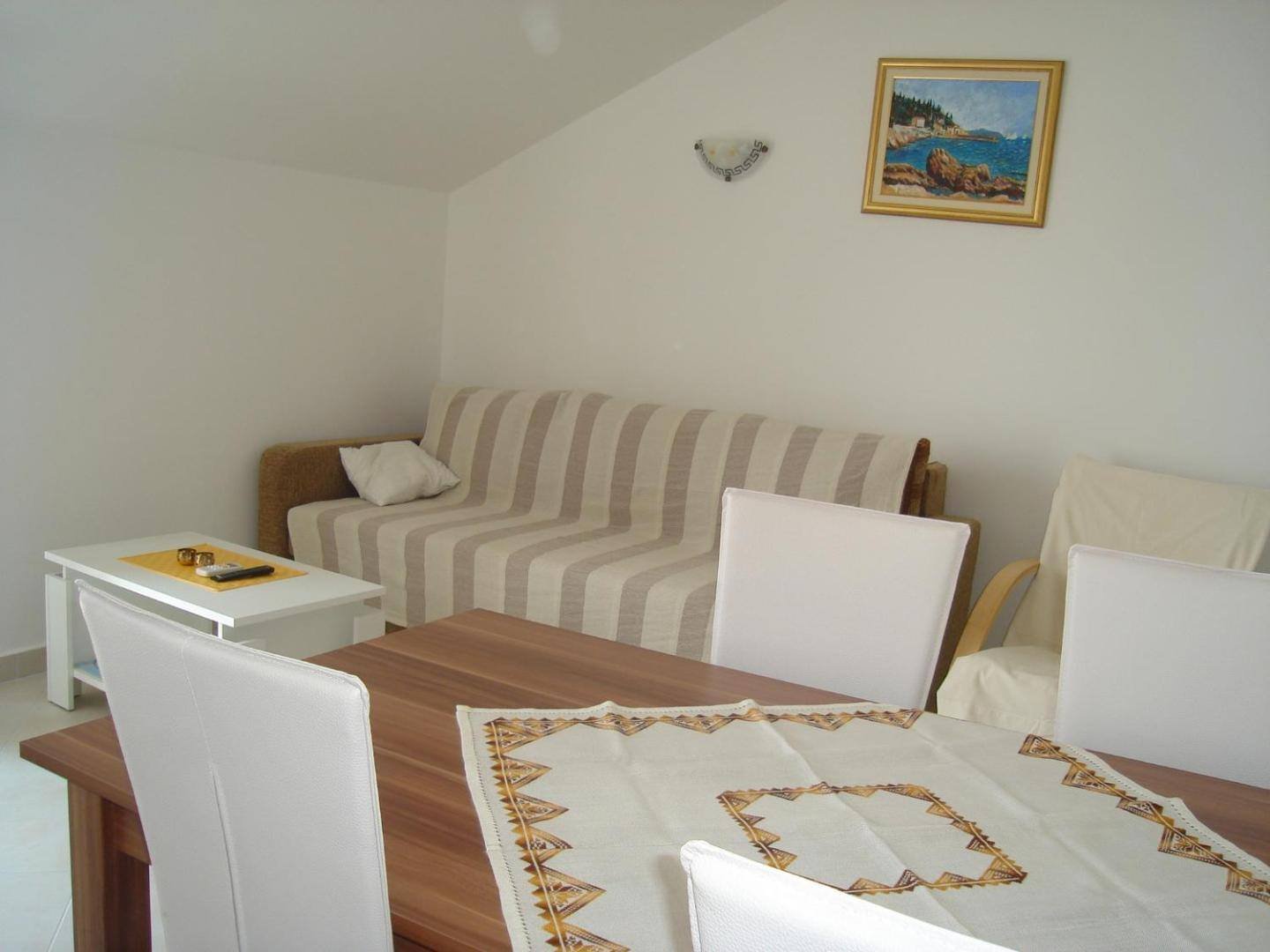 Living area with sofa and dining table